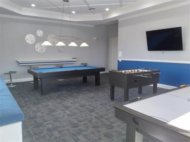 game room with dark carpet, a raised ceiling, ornamental molding, and pool table