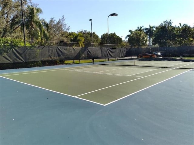 view of sport court featuring basketball hoop