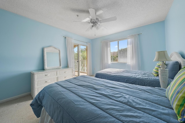 bedroom with access to exterior, a textured ceiling, light colored carpet, and ceiling fan