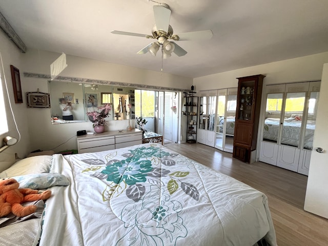 bedroom with hardwood / wood-style flooring and ceiling fan