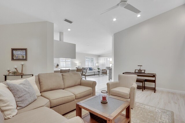 kitchen with white cabinetry, stainless steel fridge with ice dispenser, a breakfast bar, and light tile patterned floors