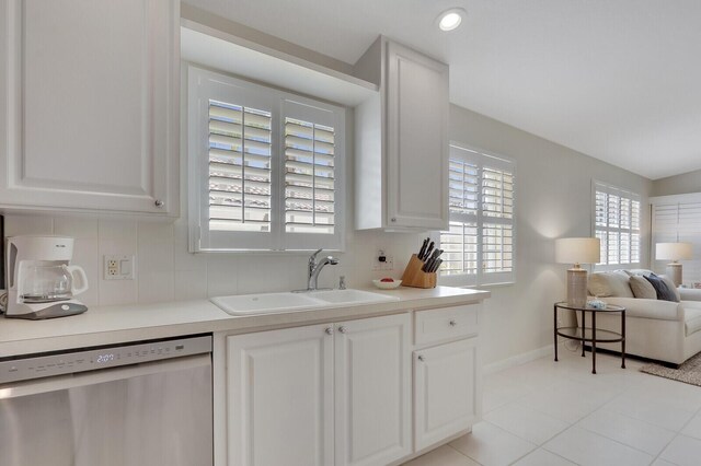 living room featuring light tile patterned floors and vaulted ceiling