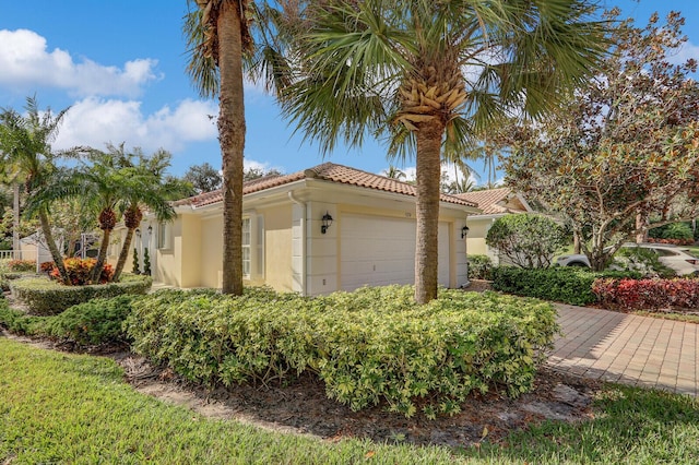 view of side of property with a garage