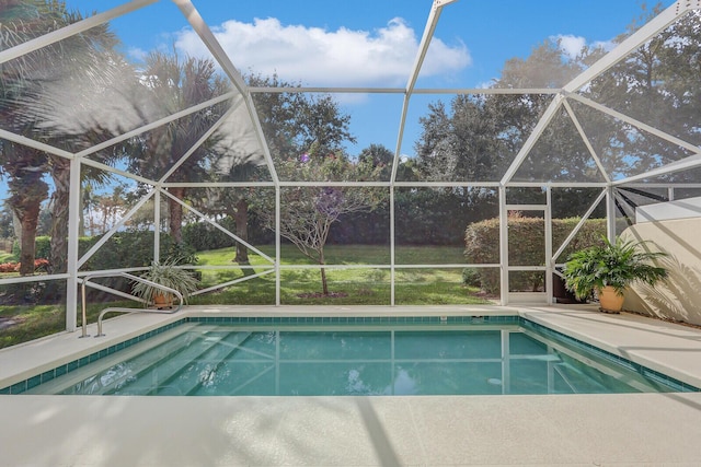 view of swimming pool with glass enclosure