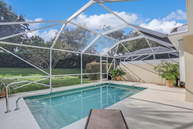 view of swimming pool with a lawn, a lanai, and a patio