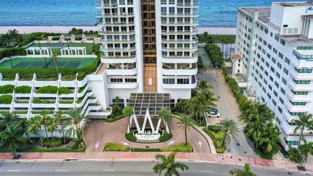 balcony with a view of the beach and a water view