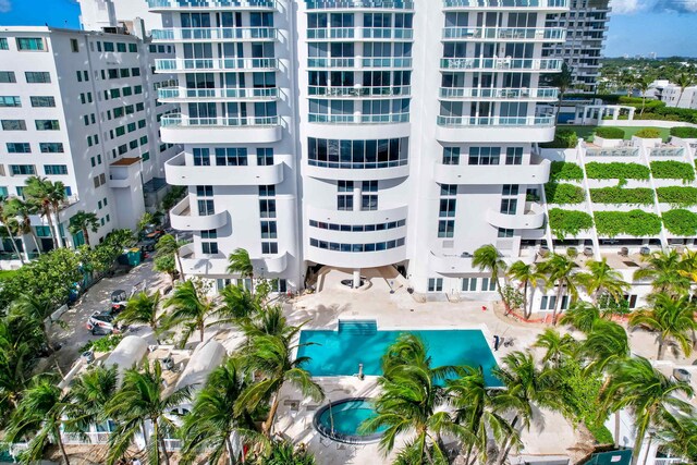 drone / aerial view with a water view and a view of the beach