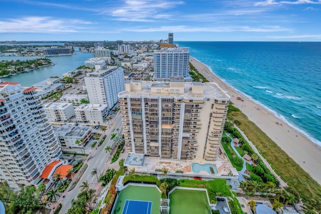 birds eye view of property featuring a view of the beach and a water view