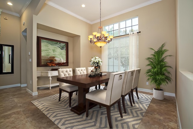 dining area with ornamental molding and a notable chandelier