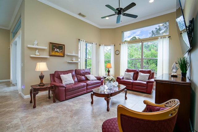 living room with crown molding, plenty of natural light, and ceiling fan