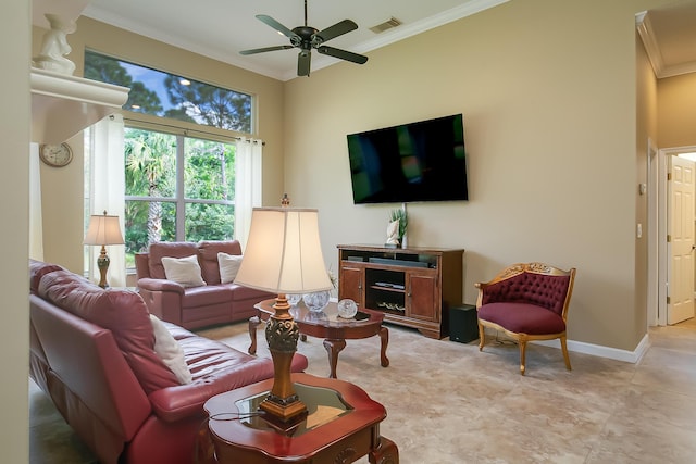 living room with ceiling fan and ornamental molding