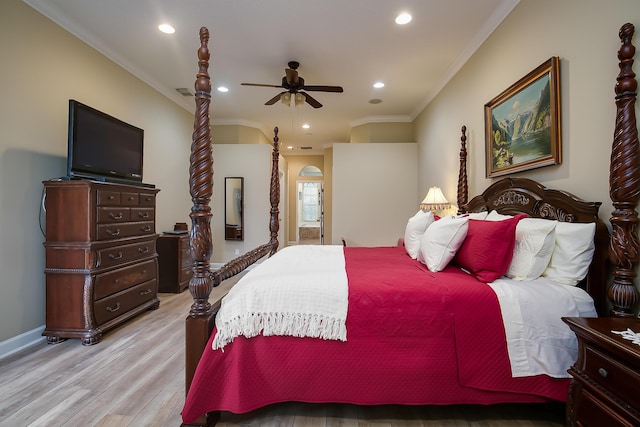 bedroom featuring ceiling fan, light wood-type flooring, and ornamental molding