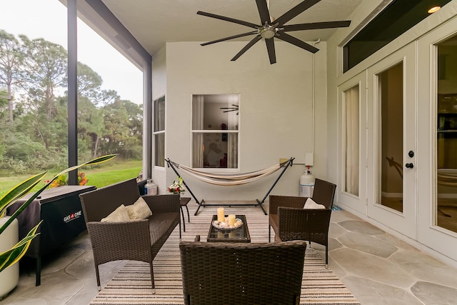 sunroom / solarium with ceiling fan