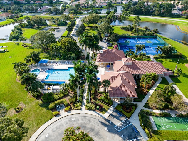 birds eye view of property with a water view