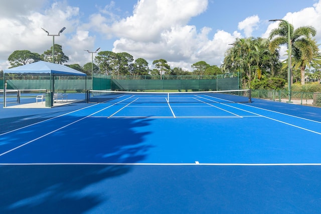 view of sport court with basketball hoop