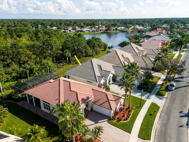 birds eye view of property with a water view