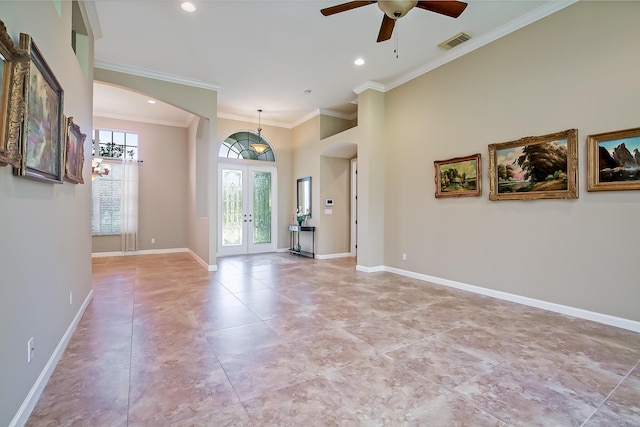 interior space featuring ceiling fan, crown molding, a high ceiling, and french doors