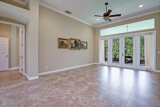 spare room with crown molding, french doors, and ceiling fan