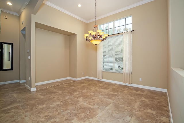 spare room featuring a chandelier and ornamental molding