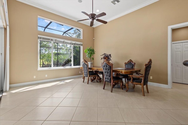 dining room with light tile patterned floors, ceiling fan, and ornamental molding