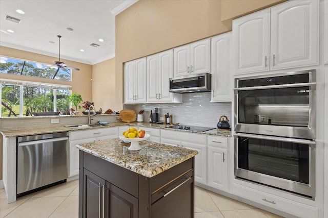 kitchen with white cabinets, stainless steel appliances, and sink