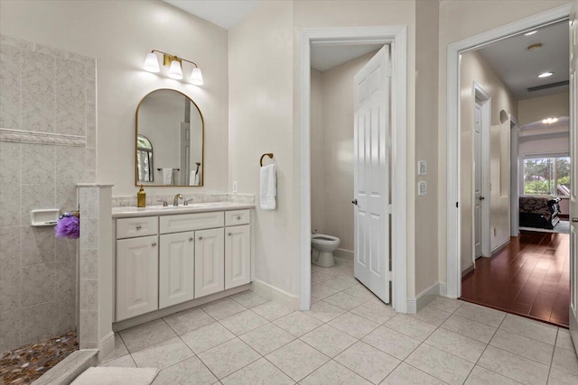 bathroom featuring tile patterned flooring and vanity