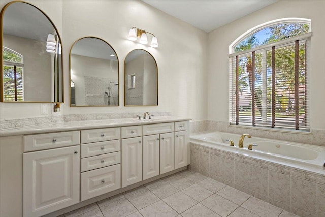 bathroom featuring tile patterned floors, vanity, and a wealth of natural light