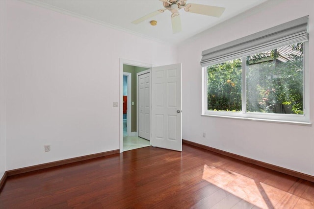 spare room featuring ceiling fan and dark hardwood / wood-style flooring