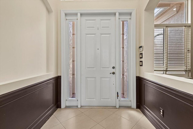 foyer entrance featuring light tile patterned floors