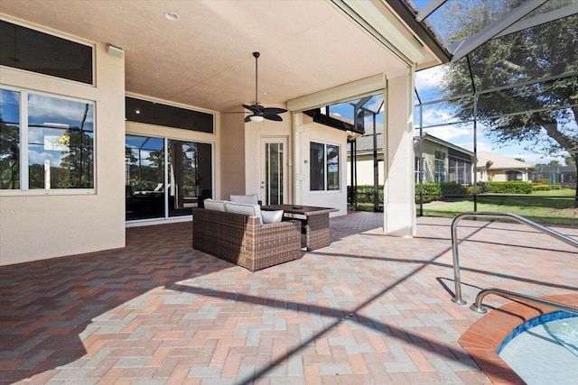 view of patio / terrace featuring ceiling fan and a lanai