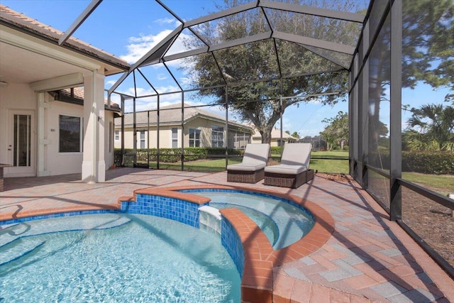 view of swimming pool with a lanai, an in ground hot tub, and a patio