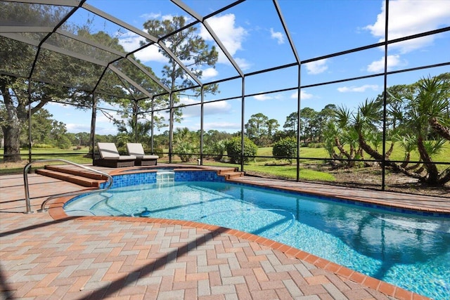 view of swimming pool with a patio area and a lanai