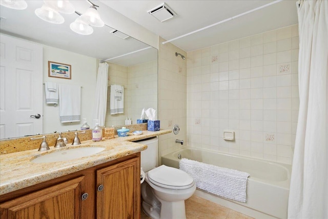 full bathroom featuring vanity, shower / tub combo, tile patterned floors, and toilet