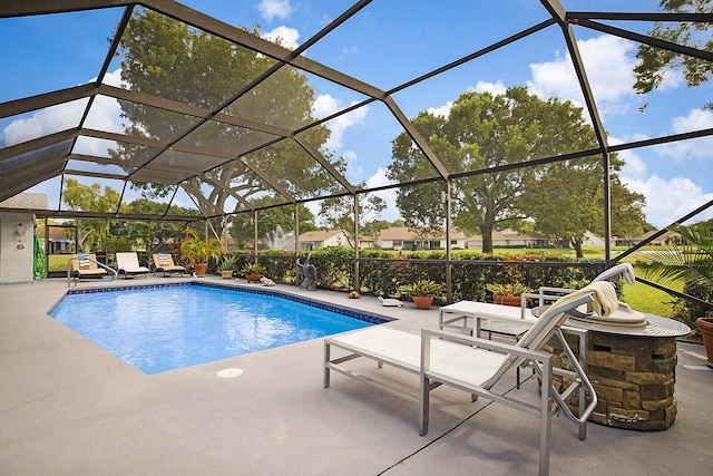 pool featuring a lanai and a patio area