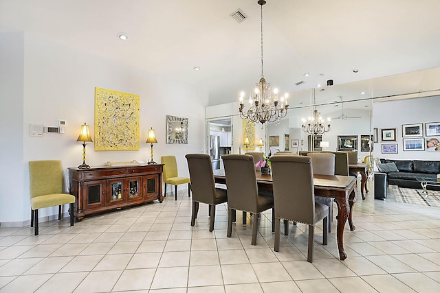 dining space featuring recessed lighting, visible vents, a notable chandelier, and light tile patterned flooring