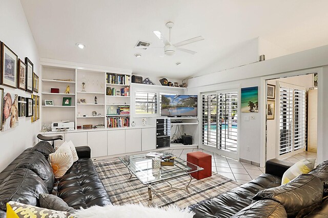 tiled living room featuring vaulted ceiling and ceiling fan