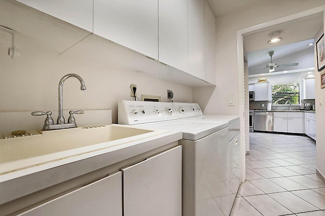 laundry room featuring washer and clothes dryer, light tile patterned floors, cabinet space, a ceiling fan, and a sink