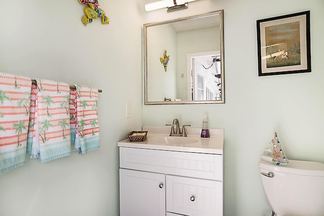 half bath with toilet and vanity