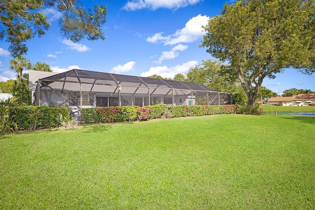 view of yard featuring glass enclosure