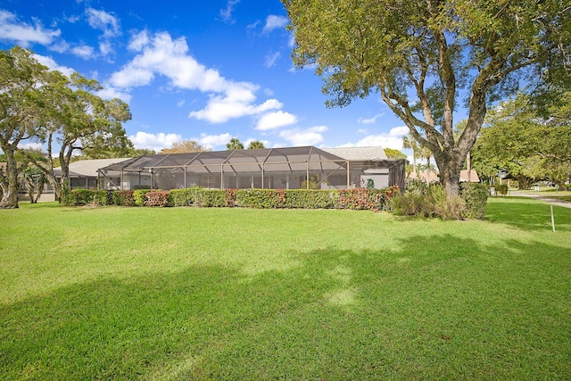 view of yard with a lanai