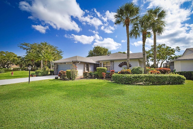 ranch-style home with an attached garage, driveway, and a front yard