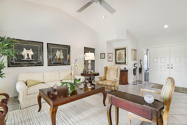 tiled living room featuring ceiling fan and lofted ceiling