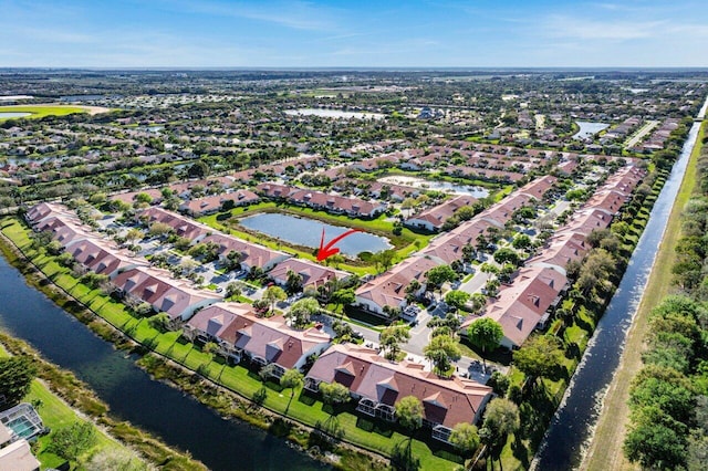 aerial view featuring a water view and a residential view