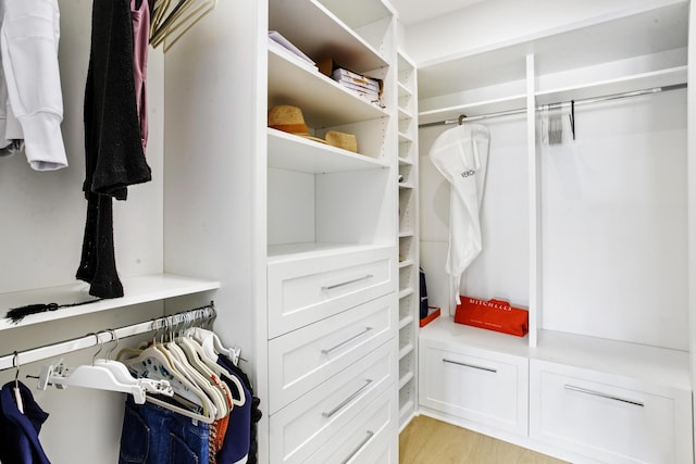 walk in closet featuring light hardwood / wood-style floors