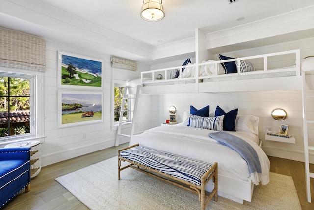 bedroom with hardwood / wood-style flooring