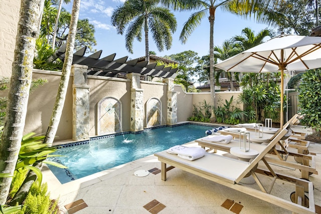 view of swimming pool featuring pool water feature and a patio area