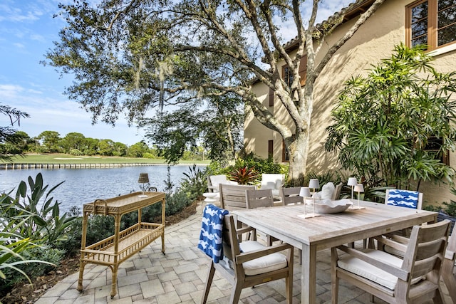 view of patio featuring a water view