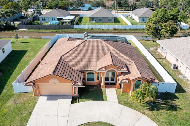 birds eye view of property featuring a water view