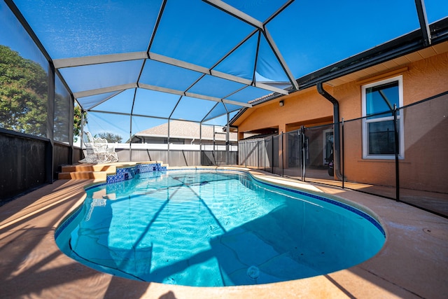 view of pool featuring a lanai and a patio