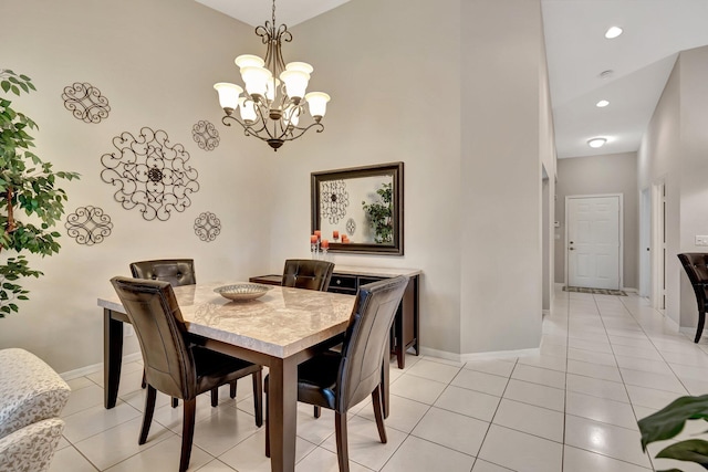 dining space featuring a notable chandelier and light tile patterned floors